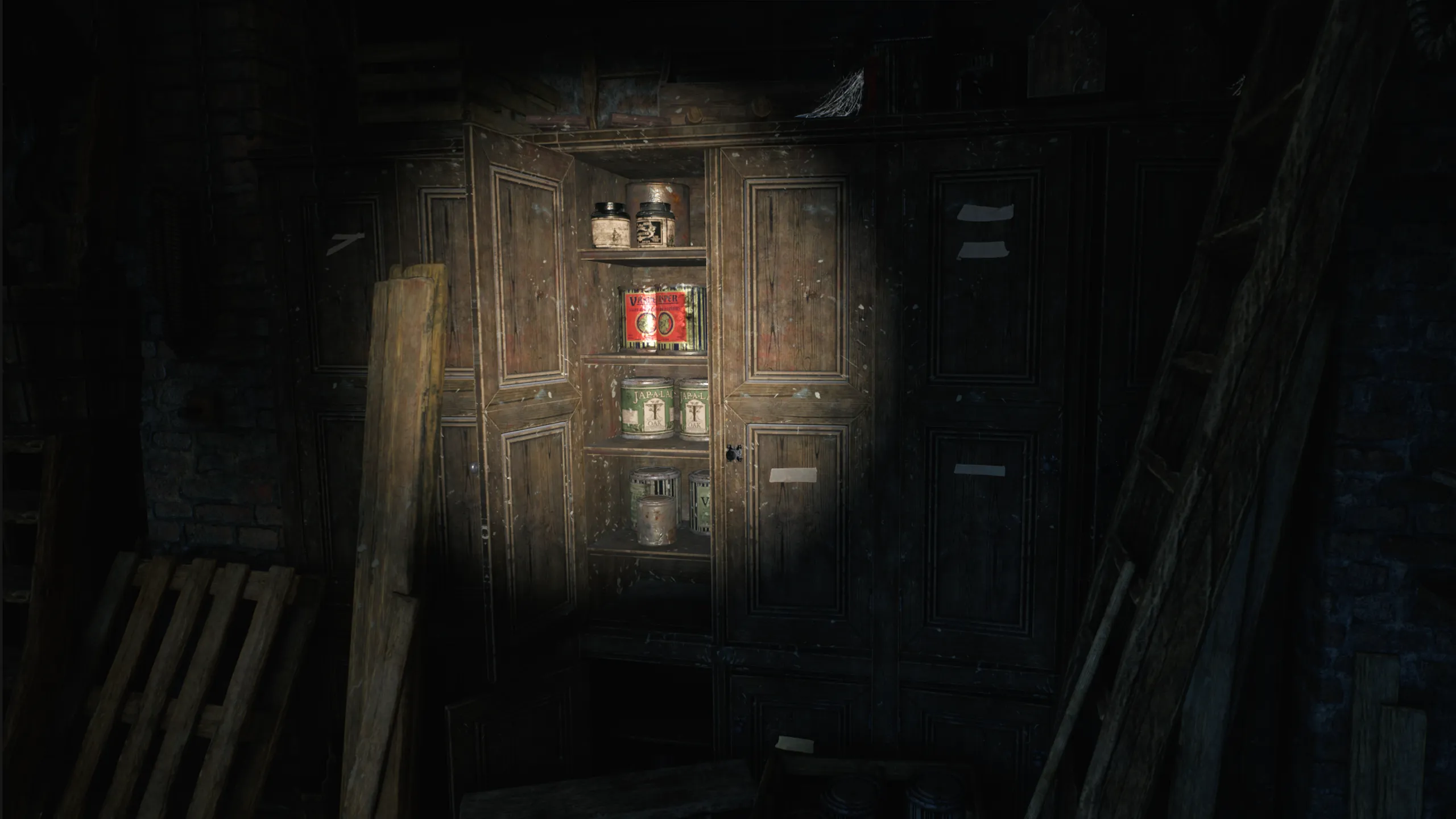 Cursor Aim lighting the jars inside an open cabinet.